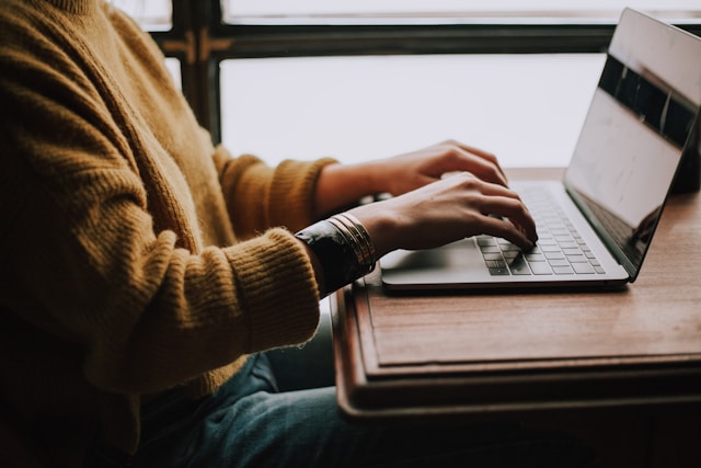 Person working at a desk. Photo: Unsplash
