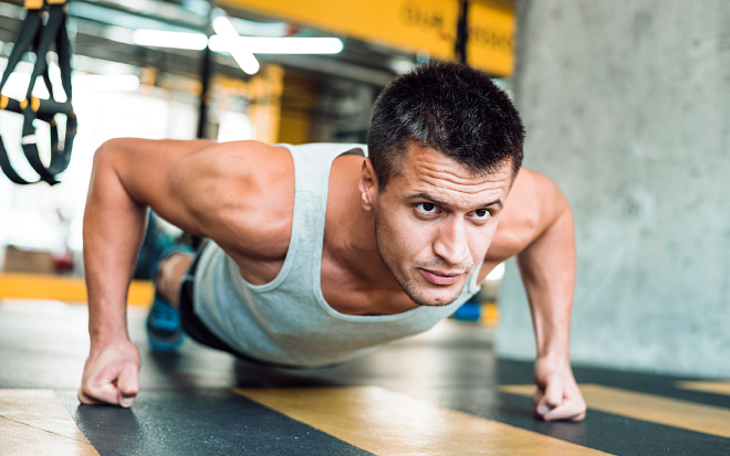 Close-up of a man training wrists and forearms in the gym